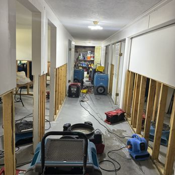 Flood cut and full structural drying in a finished basement hallway