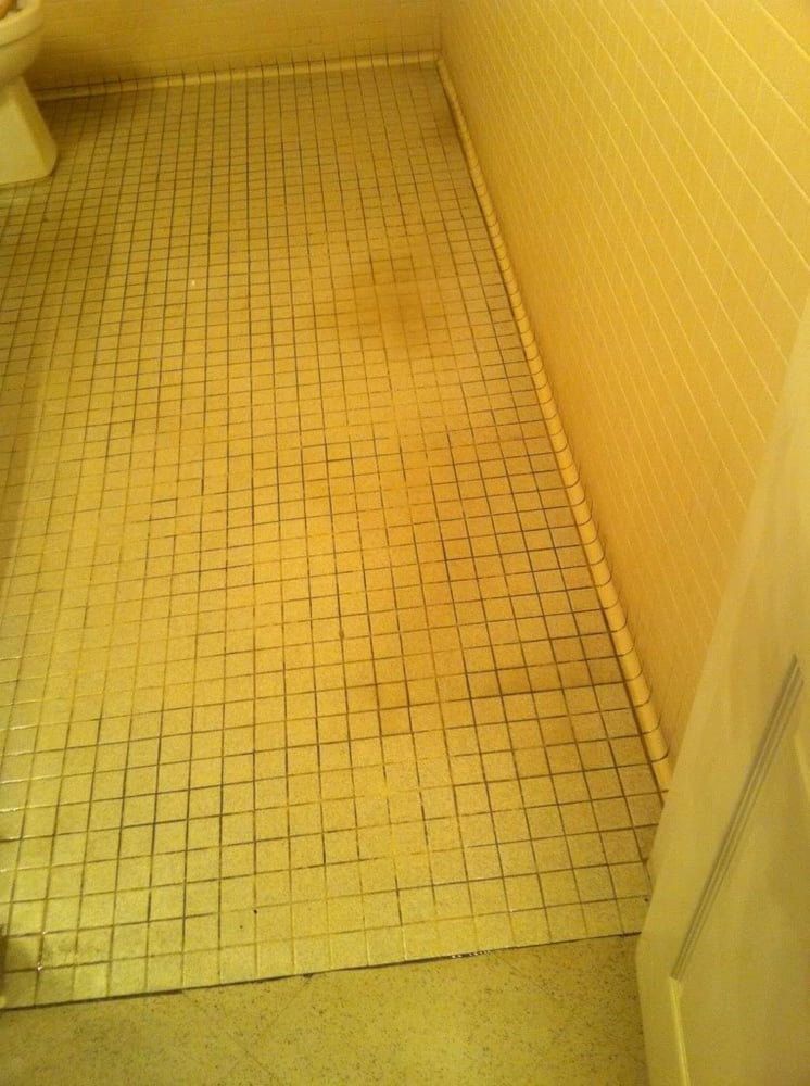 Tile bathroom floor dried and restored after a water leak